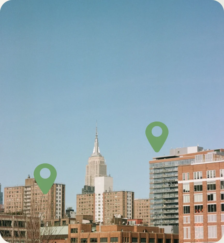 A city skyline with map pins
